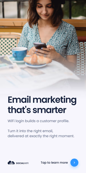 Guest relaxing at a cafe table with coffee and a croissant while checking her phone, next to the headline 'Email marketing that's smarter'