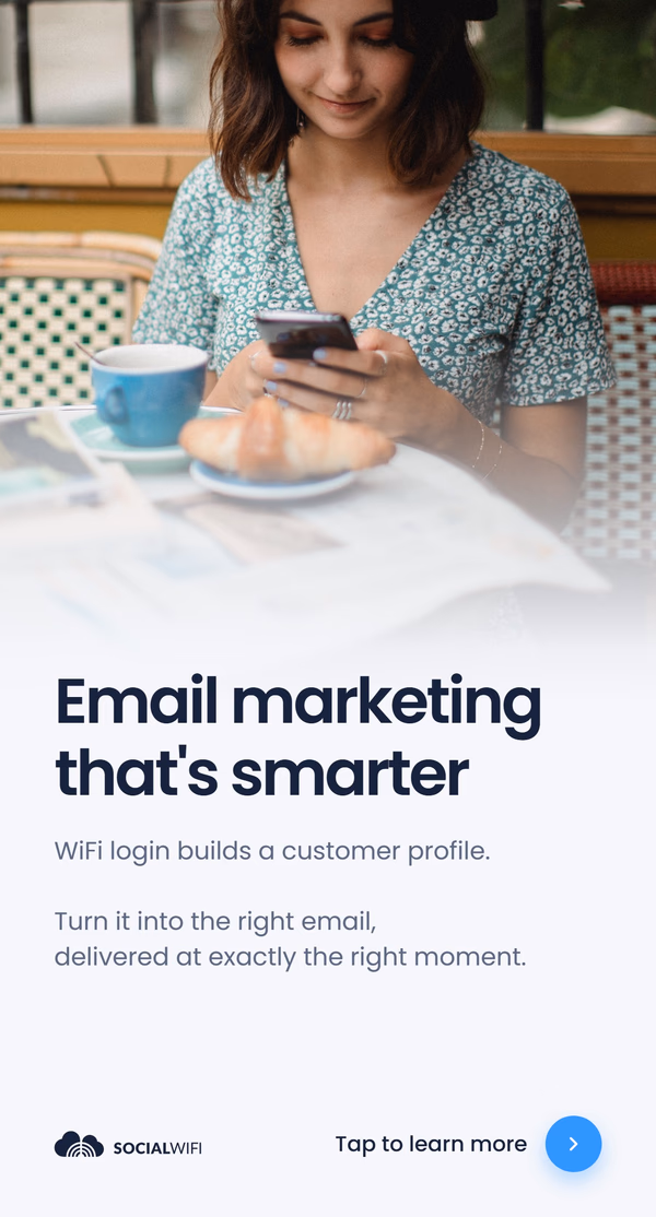 Guest relaxing at a cafe table with coffee and a croissant while checking her phone, next to the headline 'Email marketing that's smarter'