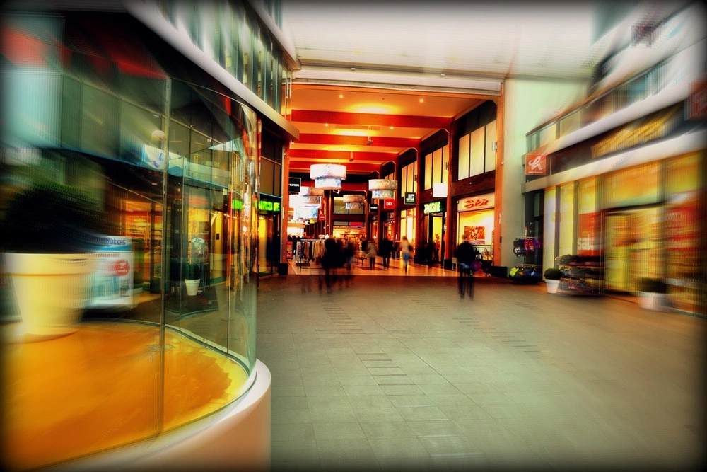 blurred out shot of a busy shopping mall corridor