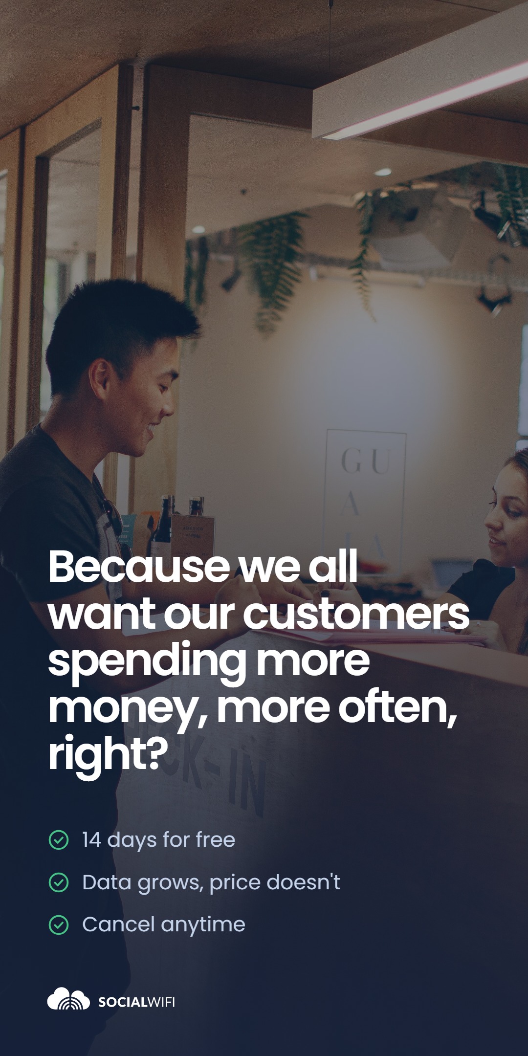 Hotel guest checking in with a smiling receptionist at the front desk, with the headline 'Because we all want our customers spending more money, more often, right?' and a checklist reading '14 days for free', 'Data grows, price doesn't' and 'Cancel anytime'